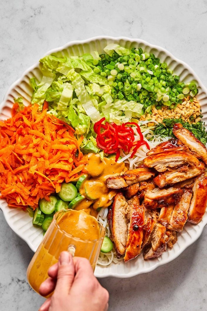 Pour dressing over salad