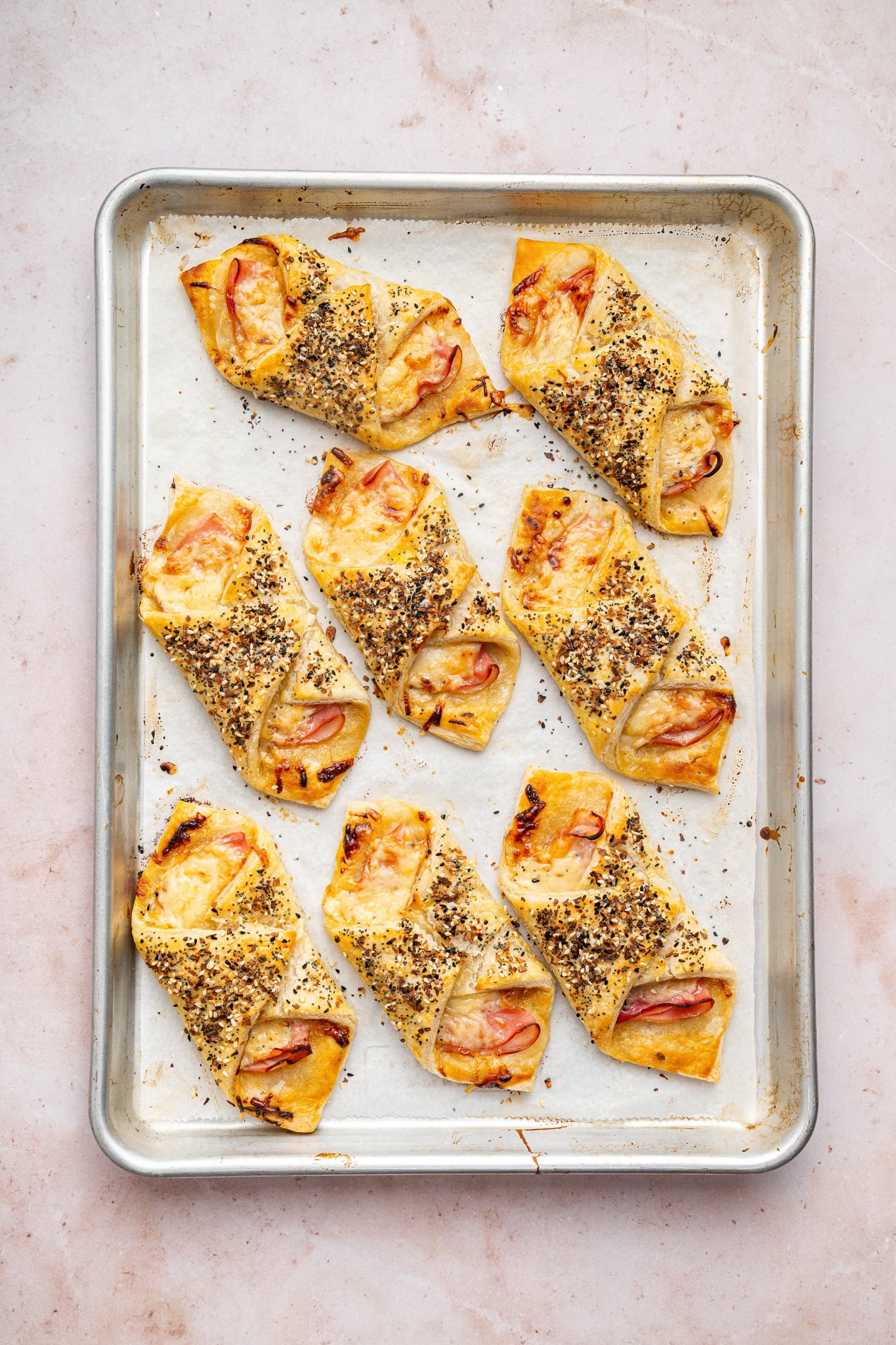 Ham and Cheese Puff Pastry Bundles | Every Last Bite baking in the oven